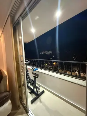 a room with a window with a view of a city at Full apartment in Laureles in Medellín