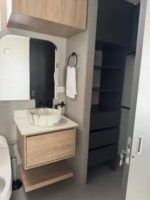 a bathroom with a sink and a mirror at Refugio en laureles in Medellín