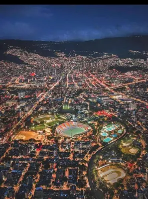 an aerial view of a city at night at Apartamento balcón laureles estadio ED Milagros in Medellín