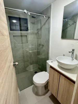 a bathroom with a shower and a toilet and a sink at Apartamento laureles estadio 201 ED MILA in Medellín