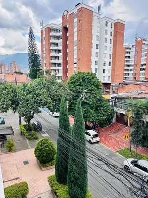 a view of a city street with trees and buildings at Apartamento laureles estadio 201 ED MILA in Medellín