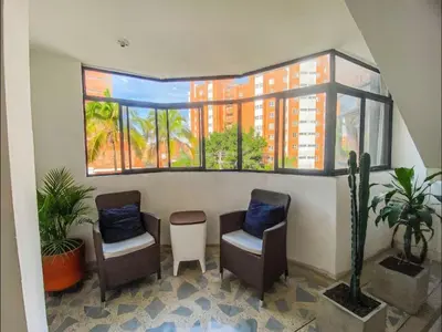 a waiting room with two chairs and a window at Exclusive Stadium Apartment in Medellín