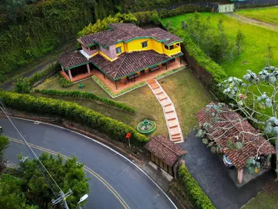 a model of a house with a yellow at Portofino mountain retreat near Medellín in Envigado