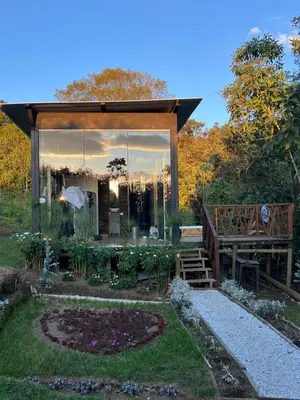 a pavilion with a garden in the yard at Pazionart Chalets in Santa Elena