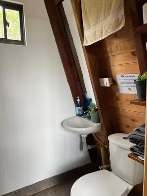 a bathroom with a toilet and a sink at Pazionart Chalets in Santa Elena