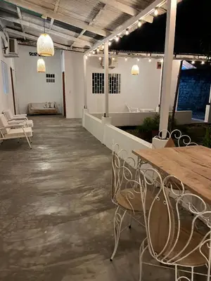 a room with a table and chairs and lights at El Cortijo