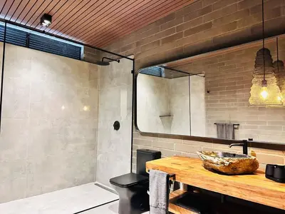 a bathroom with a counter with a bowl on a table at Exclusive Villa - Lake View - Forest in La Pradera