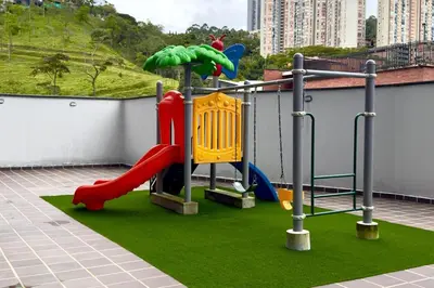 a childrens playground with a slide and a slideintend at Apartamento completo en Sabaneta in Sabaneta