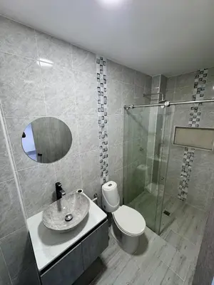 a bathroom with a sink and a toilet and a mirror at Nautica Resort in Sopetran