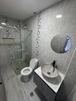 a bathroom with a sink and a toilet and a mirror at Nautica Resort in Sopetran