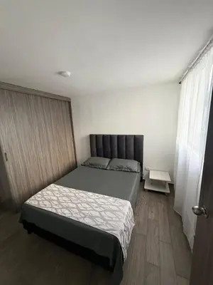 a bedroom with a bed in a room at Simplemente en Casa! in Manizales
