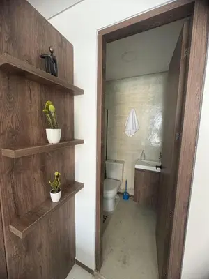 a bathroom with a toilet and a sink at Faro 201, 202, 203 Lujo en Laureles Ubicación Premium in Medellín