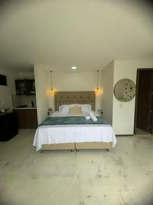a bedroom with a large bed in a room at Faro 201, 202, 203 Lujo en Laureles Ubicación Premium in Medellín