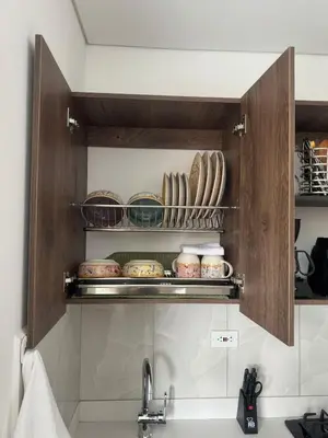 a kitchen cabinet with plates and dishes in it at 22 Comfort and style in Medellín Laureles in Medellín