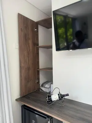 a cupboard with a camera on a counter in a room at 22 Comfort and style in Medellín Laureles in Medellín