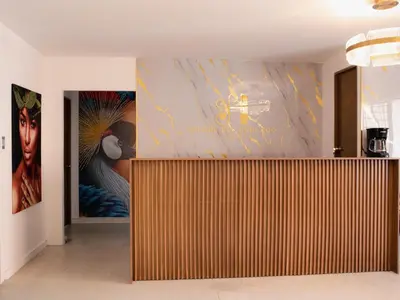a room with a wall with a large painting at Casa solare in Medellín
