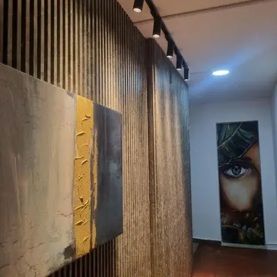 a wall with two pieces of art on it at Casa solare in Medellín