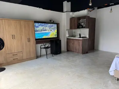 a large living room with a large flat screen tv at 24 Laureles Prime Elegancia y Comodidad Medellín in Medellín