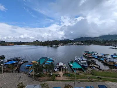 a large body of water with boats in it at Apartamento vista lago 202 in Guatapé
