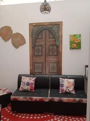 a living room with a couch and a door at Apartamento vista lago 202 in Guatapé