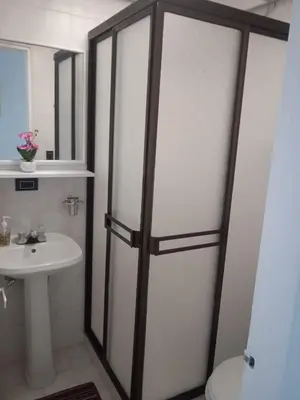 a bathroom with a toilet and a sink at Apartamento vista lago 202 in Guatapé