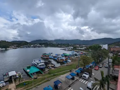 a group of boats parked next to a body of water at Apartamento vista lago 202 in Guatapé