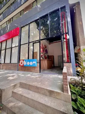 a building with a sign on the front of it at Bloom by Simple Stay in Medellín