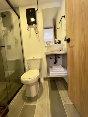 a bathroom with a toilet and a sink at Bloom by Simple Stay in Medellín