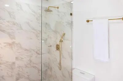 a shower with a glass door and a toilet at Exclusive Luxury Apartment - Poblado Medellín in Medellín