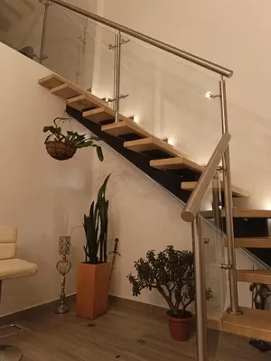 a staircase in a living room with potted plants at Penthouse with Jacuzzi in Guarne in Guarne