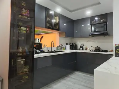 a kitchen with black cabinets and white counter tops at Penthouse with Jacuzzi in Guarne in Guarne