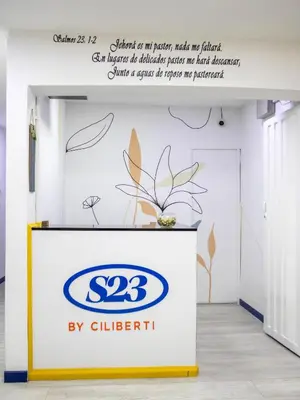 a sign for a showroom with the logo on it at S23 I City Lodge in Sabaneta