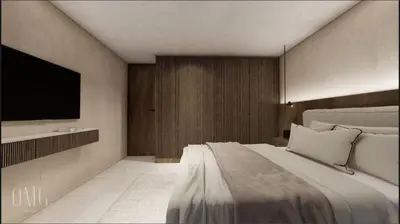 a bedroom with a large bed and a flat screen tv at Moderno y luminoso apartamento de 3 habitaciones 314 in Medellín