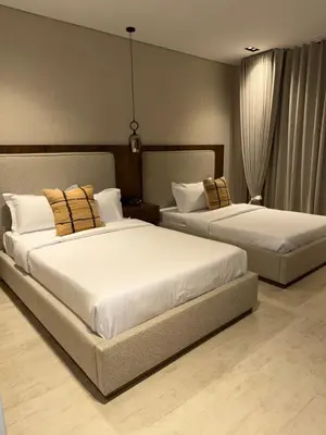 two beds in a hotel room with two at Moderno y luminoso apartamento de 3 habitaciones 314 in Medellín