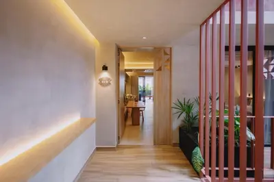 a hallway with a staircase leading into a house at Kuuna Medellín By Be Host in Medellín