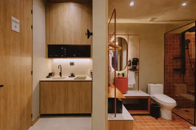 a bathroom with a sink and a toilet at Kuuna Medellín By Be Host in Medellín