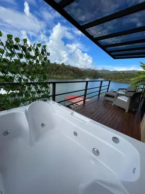 a white bath tub sitting on top of a deck at Boreal Glamping in Guatapé