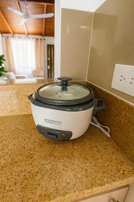 a slow cooker sitting on a counter in a kitchen at Casa Bosques in Pilarica - Family and cozy in Medellín
