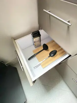 a kitchen cabinet with two spoons and a clock on it at Casa Bosques in Pilarica - Family and cozy in Medellín