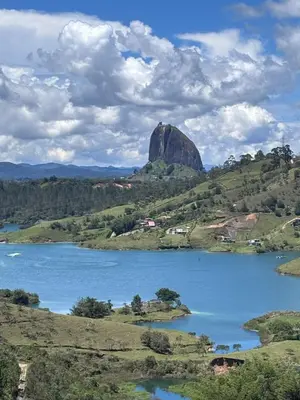 a view of a lake with a mountain in the background at Finca El Encanto Guatapé in Guatapé