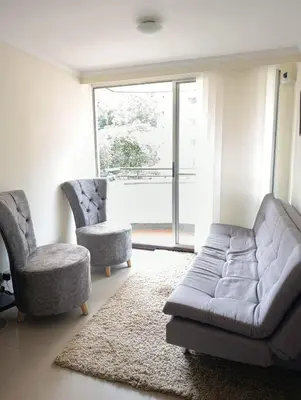 a living room with a couch and two chairs at Perfect place to relax! in Medellín