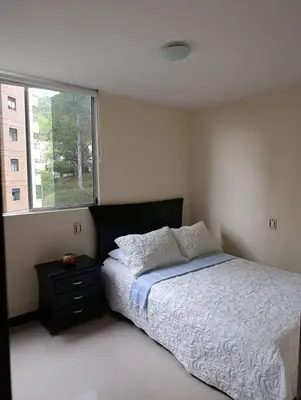 a bedroom with a large bed and a window at Perfect place to relax! in Medellín