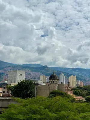 a view of a city with buildings and trees at Hotel Plaza Mayor 44 in Medellín