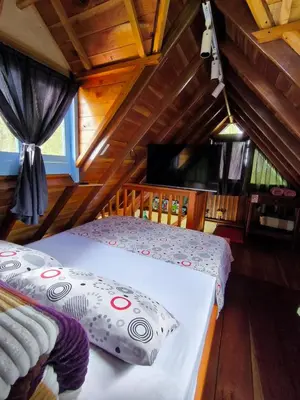 a bedroom with a bed in a cabin at Cabaña El Jericoano in Jericó