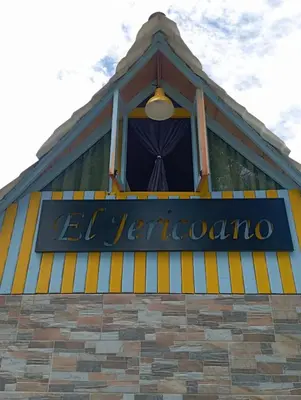 a sign on the side of a building at Cabaña El Jericoano in Jericó