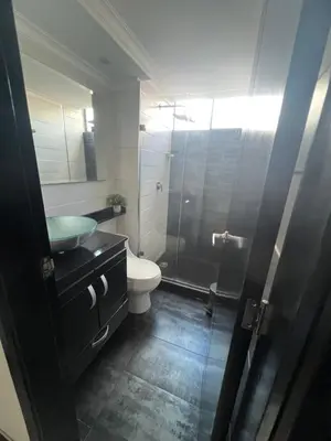 a bathroom with a sink and a toilet and a shower at Apartamento Medellín in Medellín
