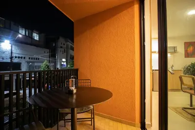 a table and chair sitting on a balcony at 202 Modern Stay in Laureles Area Cozy Balcony AC in Medellín