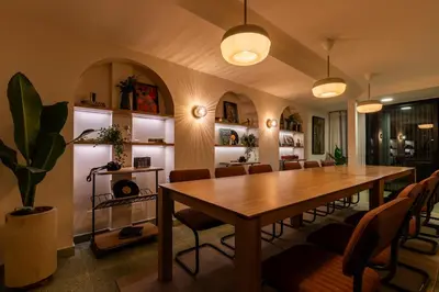 a dining room with a wooden table and chairs at 202 Modern Stay in Laureles Area Cozy Balcony AC in Medellín
