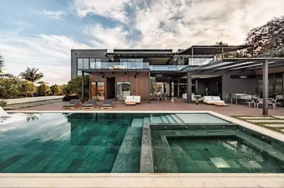 a house with a swimming pool in front of it at Luxurious Farm House Finca Libia in Guarne
