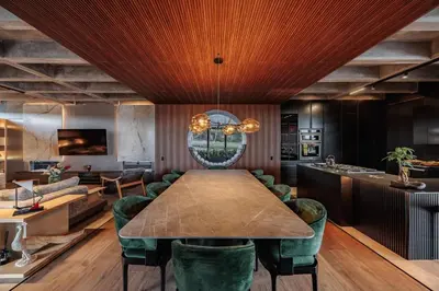 a dining room with a table and green chairs at Luxurious Farm House Finca Libia in Guarne